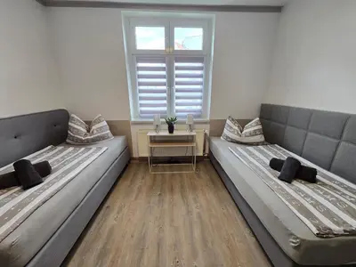 Ein Bett oder Betten in einem Zimmer der Unterkunft FeWo 5 Personen, Nähe Bahnhof, WLAN,Balkon