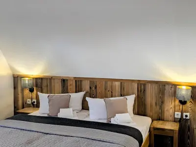 Ein Bett oder Betten in einem Zimmer der Unterkunft Harzlodge Hilly