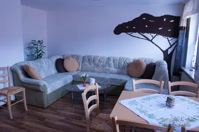 Ein Sitzbereich in der Unterkunft Gruppenhaus bis 14 Personen im Südharz