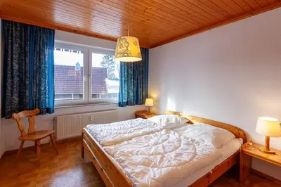 Ein Bett oder Betten in einem Zimmer der Unterkunft Ferienwohnung Sanne mit Balkon - direkt am Kurpark