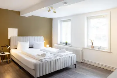 Ein Bett oder Betten in einem Zimmer der Unterkunft Ferienwohnung Tatort