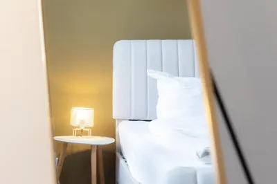 Ein Bett oder Betten in einem Zimmer der Unterkunft Ferienwohnung Tatort
