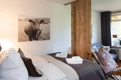 Ein Bett oder Betten in einem Zimmer der Unterkunft Ferienwohnung der Berg ruft