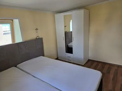 Ein Bett oder Betten in einem Zimmer der Unterkunft Ferienwohnung Mila