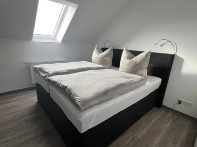 Ein Bett oder Betten in einem Zimmer der Unterkunft Filmstadt Quedlinburg