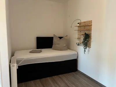 Ein Bett oder Betten in einem Zimmer der Unterkunft Filmstadt Quedlinburg