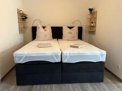 Ein Bett oder Betten in einem Zimmer der Unterkunft Filmstadt Quedlinburg