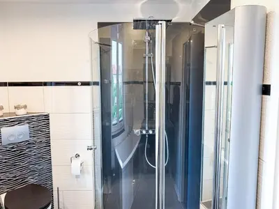 Ein Badezimmer in der Unterkunft WILD&COZY Ferienhaus mit luxuriöser Küche & Garage