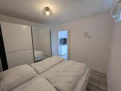 Ein Bett oder Betten in einem Zimmer der Unterkunft Altenauer Traumsicht mit Balkon