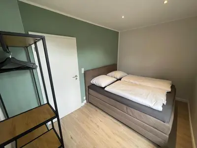 Ein Bett oder Betten in einem Zimmer der Unterkunft Cottage Cozy Gästehaus
