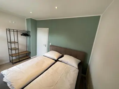 Ein Bett oder Betten in einem Zimmer der Unterkunft Cottage Cozy Gästehaus