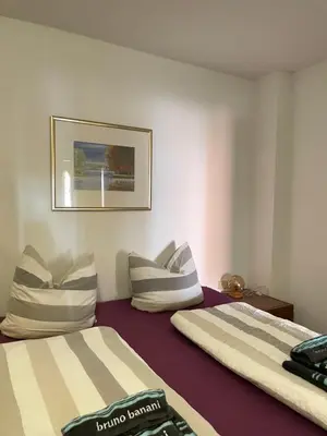 Ein Bett oder Betten in einem Zimmer der Unterkunft Ferienwohnungen am Roland