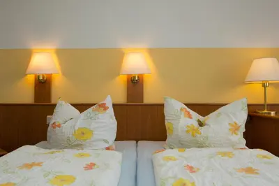 Ein Bett oder Betten in einem Zimmer der Unterkunft Hotel St Hubertus Wienrode