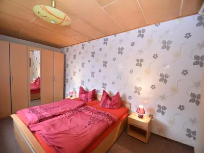 Ein Bett oder Betten in einem Zimmer der Unterkunft Ferienhaus in Cattenstedt Harz mit Garten