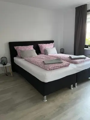 Ein Bett oder Betten in einem Zimmer der Unterkunft Ferienwohnung Appartement am Wildpark Bad Harzburg