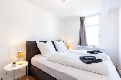 Ein Bett oder Betten in einem Zimmer der Unterkunft PrimeLoft 