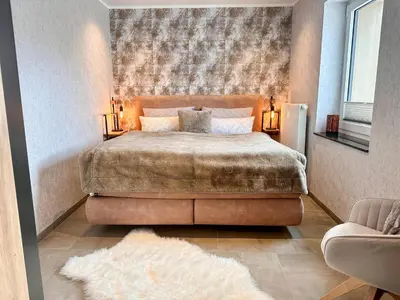 Ein Bett oder Betten in einem Zimmer der Unterkunft WILD&COZY Ferienhaus mit 160m2, Garage und 2 Bäder