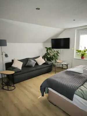 Ein Bett oder Betten in einem Zimmer der Unterkunft Ferienwohnung Am Sonnenbrink
