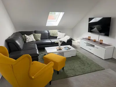 Ein Sitzbereich in der Unterkunft Ferienwohnung Am Teufelsmauerstieg