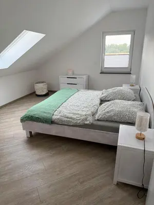Ein Bett oder Betten in einem Zimmer der Unterkunft Ferienwohnung Am Teufelsmauerstieg