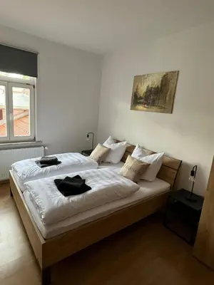 Ein Bett oder Betten in einem Zimmer der Unterkunft City-Apartment