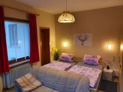 Ein Bett oder Betten in einem Zimmer der Unterkunft Ferienwohnungen Kempe - Hauptstraße