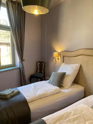 Ein Bett oder Betten in einem Zimmer der Unterkunft Gästehaus Unter den Weiden, Halberstadt