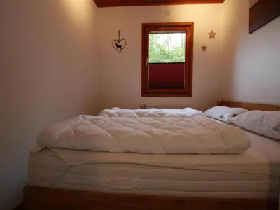 Ein Bett oder Betten in einem Zimmer der Unterkunft Ferienhaus in der Nähe des Sees, Haustierfrei