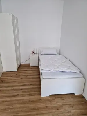 Ein Bett oder Betten in einem Zimmer der Unterkunft Sattlerhexe
