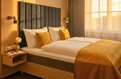 Ein Bett oder Betten in einem Zimmer der Unterkunft H24 Parkhotel Thale