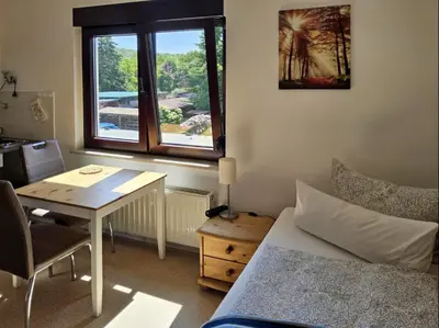 Ein Bett oder Betten in einem Zimmer der Unterkunft Haus Freigeist - zum Wanderer