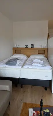 Ein Bett oder Betten in einem Zimmer der Unterkunft Theos