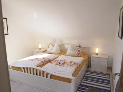 Ein Bett oder Betten in einem Zimmer der Unterkunft Ferienwohnung Schimmer