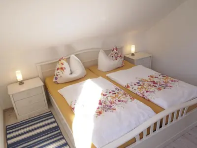 Ein Bett oder Betten in einem Zimmer der Unterkunft Ferienwohnung Schimmer