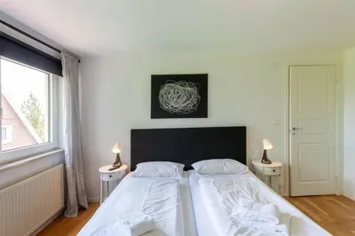 Ein Bett oder Betten in einem Zimmer der Unterkunft Ferienhaus Lars