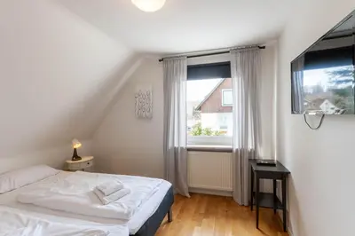 Ein Bett oder Betten in einem Zimmer der Unterkunft Ferienhaus Malte