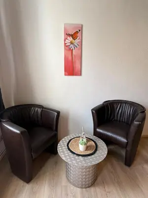 Ein Sitzbereich in der Unterkunft myna