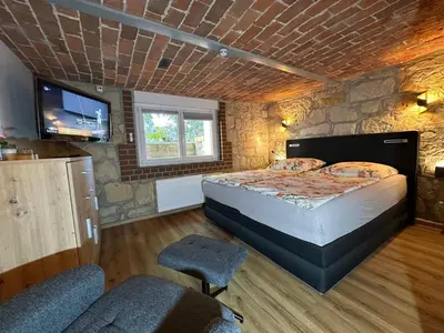 Ein Bett oder Betten in einem Zimmer der Unterkunft Ferienwohnung 
