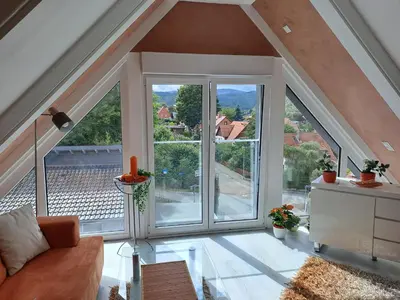 Ein Sitzbereich in der Unterkunft DESIGN-LOFT Brockenblick -Netflix-Smart TV-WLAN-Wallbox-Kaffeevollautomat-Balkon- Panoramaaussicht-Getränke-Pizza-Snacks