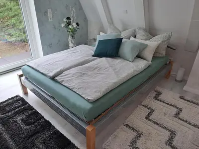 Ein Bett oder Betten in einem Zimmer der Unterkunft DESIGN-LOFT Brockenblick -Netflix-Smart TV-WLAN-Wallbox-Kaffeevollautomat-Balkon- Panoramaaussicht-Getränke-Pizza-Snacks