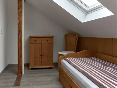 Ein Bett oder Betten in einem Zimmer der Unterkunft Haus Freigeist - zum Ortsblick