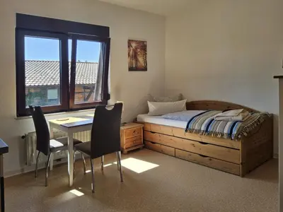 Ein Bett oder Betten in einem Zimmer der Unterkunft Haus Freigeist - zum Wanderer