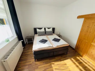 Ein Bett oder Betten in einem Zimmer der Unterkunft Traumhaus Waldeck mit Garten in der Innenstadt von Wernigerode von Harztraveler