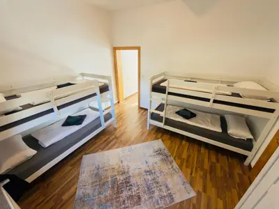 Ein Bett oder Betten in einem Zimmer der Unterkunft Traumhaus Waldeck mit Garten in der Innenstadt von Wernigerode von Harztraveler