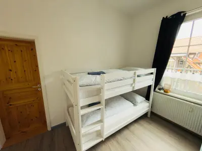 Ein Bett oder Betten in einem Zimmer der Unterkunft TraumFeWo Grüneseck in Innenstadt mit Wald von Harztraveler