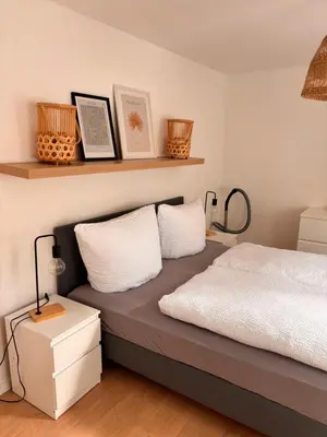 Ein Bett oder Betten in einem Zimmer der Unterkunft Modernes Apartment am Campus II