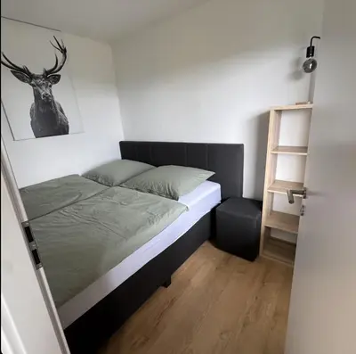 Ein Bett oder Betten in einem Zimmer der Unterkunft Ferienwohnung Platzhirsch 314 im Harz mit Pool, Sauna & schöner Aussicht in Braunlage-Hohegeiß