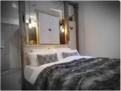 Ein Bett oder Betten in einem Zimmer der Unterkunft WLodgeOne - Wald Lodge