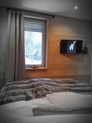 Ein Bett oder Betten in einem Zimmer der Unterkunft WLodgeOne - Wald Lodge