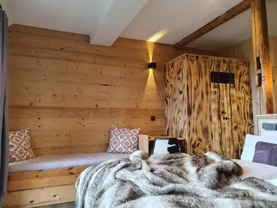 Ein Bett oder Betten in einem Zimmer der Unterkunft WLodgeOne - Wald Lodge